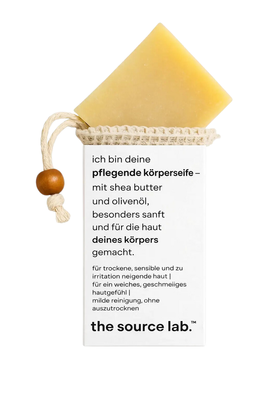 Sanfte 2-in-1 Ganzkörperseife von THE SOURCE LAB mit Peelingbeutel, 100g für Reinigung und Pflege.